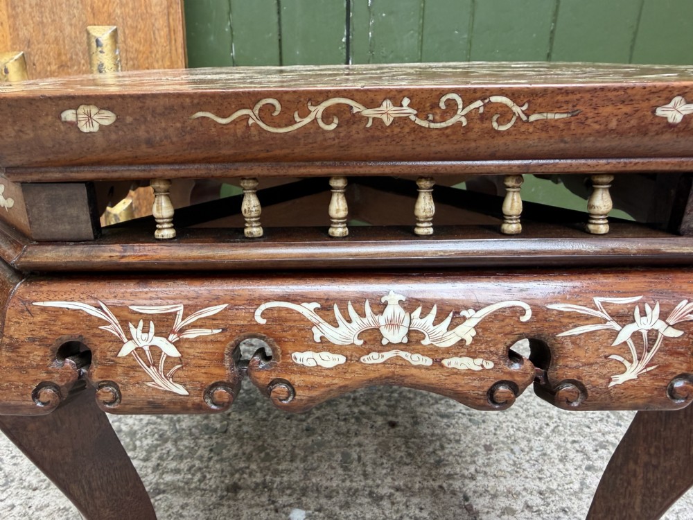 A late 19th-century Chinese dark hardwood occasional table decorated with detailed bone inlay landscape scenes, featuring cabriole legs and a carved apron. View VII