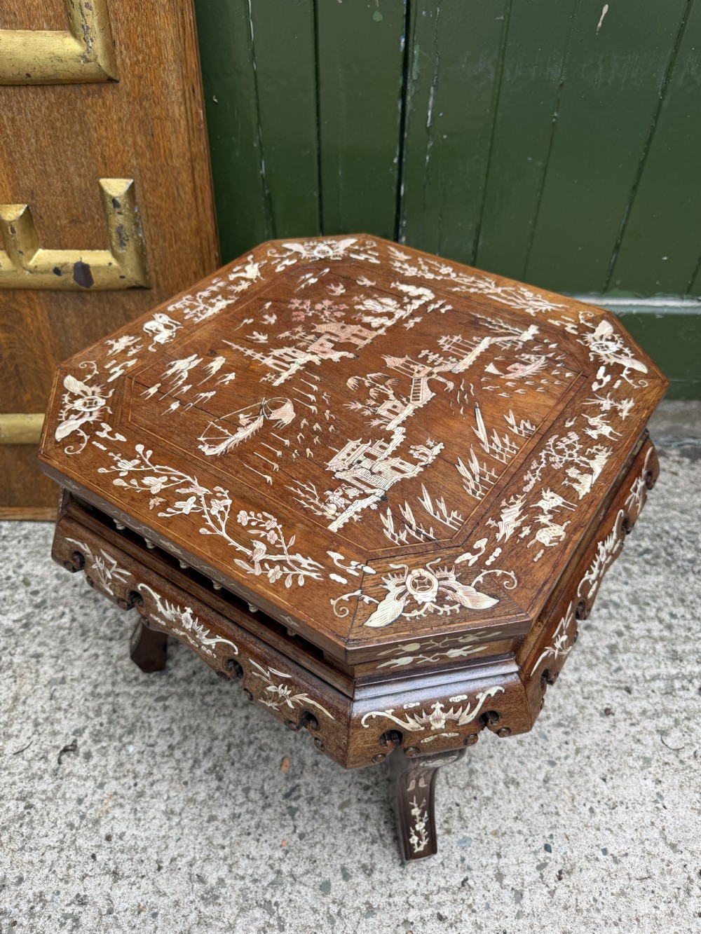 A late 19th-century Chinese dark hardwood occasional table decorated with detailed bone inlay landscape scenes, featuring cabriole legs and a carved apron. View VIII