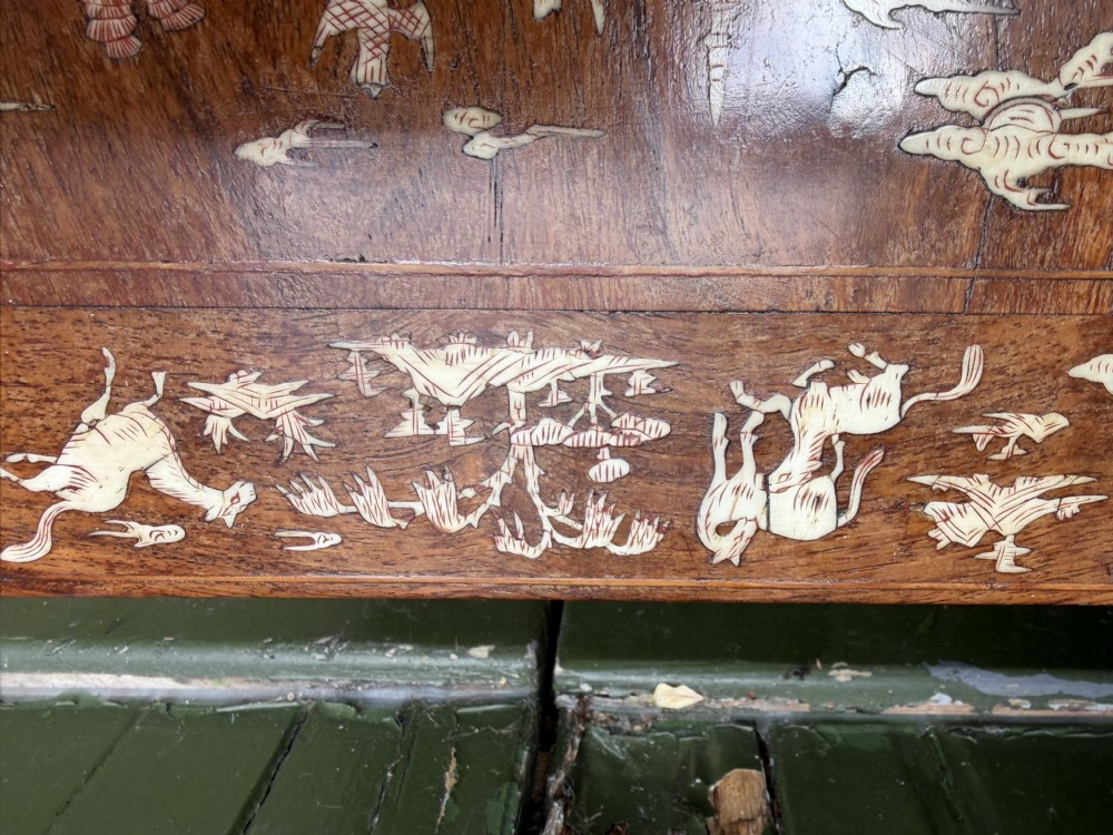 A late 19th-century Chinese dark hardwood occasional table decorated with detailed bone inlay landscape scenes, featuring cabriole legs and a carved apron. View XII