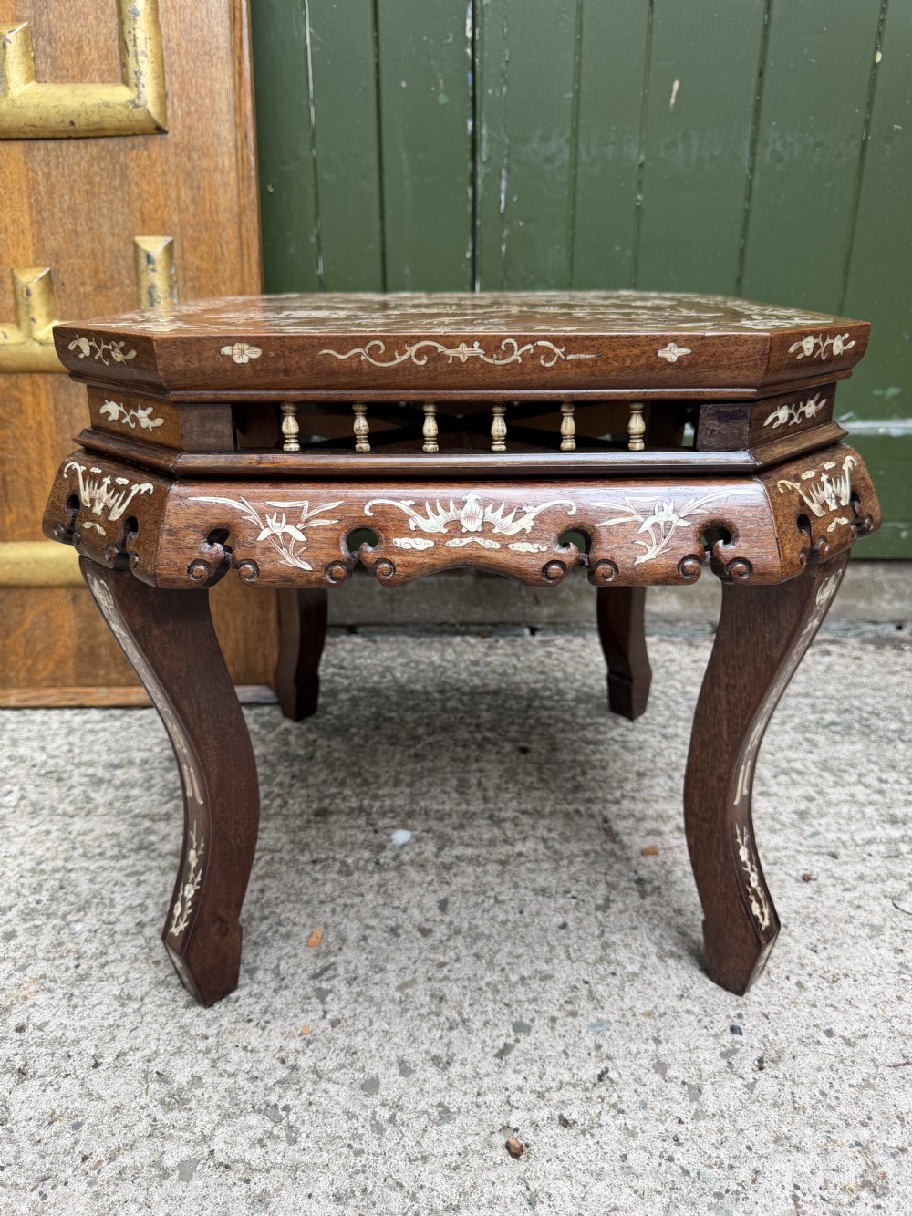 A late 19th-century Chinese dark hardwood occasional table decorated with detailed bone inlay landscape scenes, featuring cabriole legs and a carved apron. View XIV