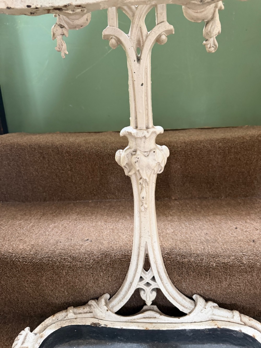 A mid 19th-century off-white painted cast-iron stick and umbrella stand with ornate tracery and a removable dark drip tray base. View VI