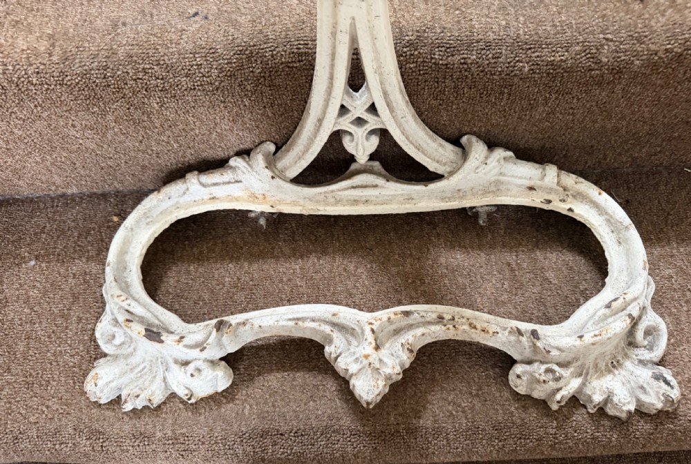 A mid 19th-century off-white painted cast-iron stick and umbrella stand with ornate tracery and a removable dark drip tray base. View VIII