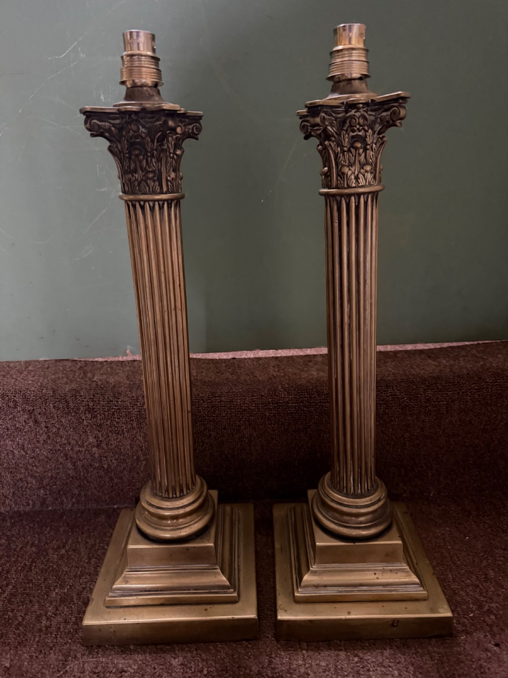 A pair of 19th-century brass table lamps featuring fluted classical Corinthian columns set on stepped square plinths. View II