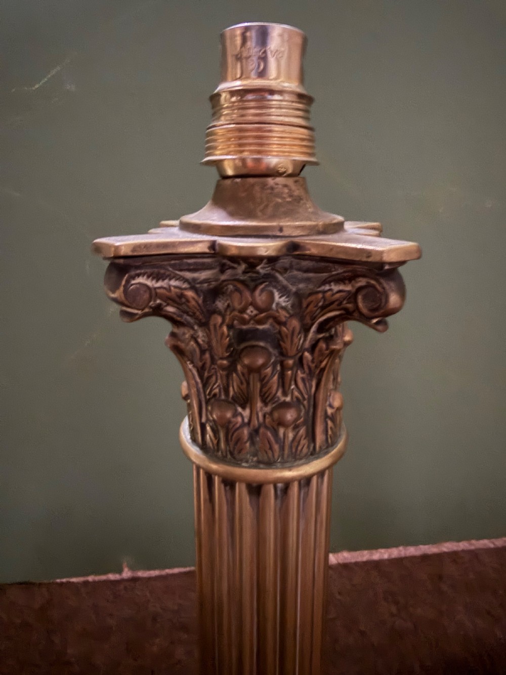A pair of 19th-century brass table lamps featuring fluted classical Corinthian columns set on stepped square plinths. View IV