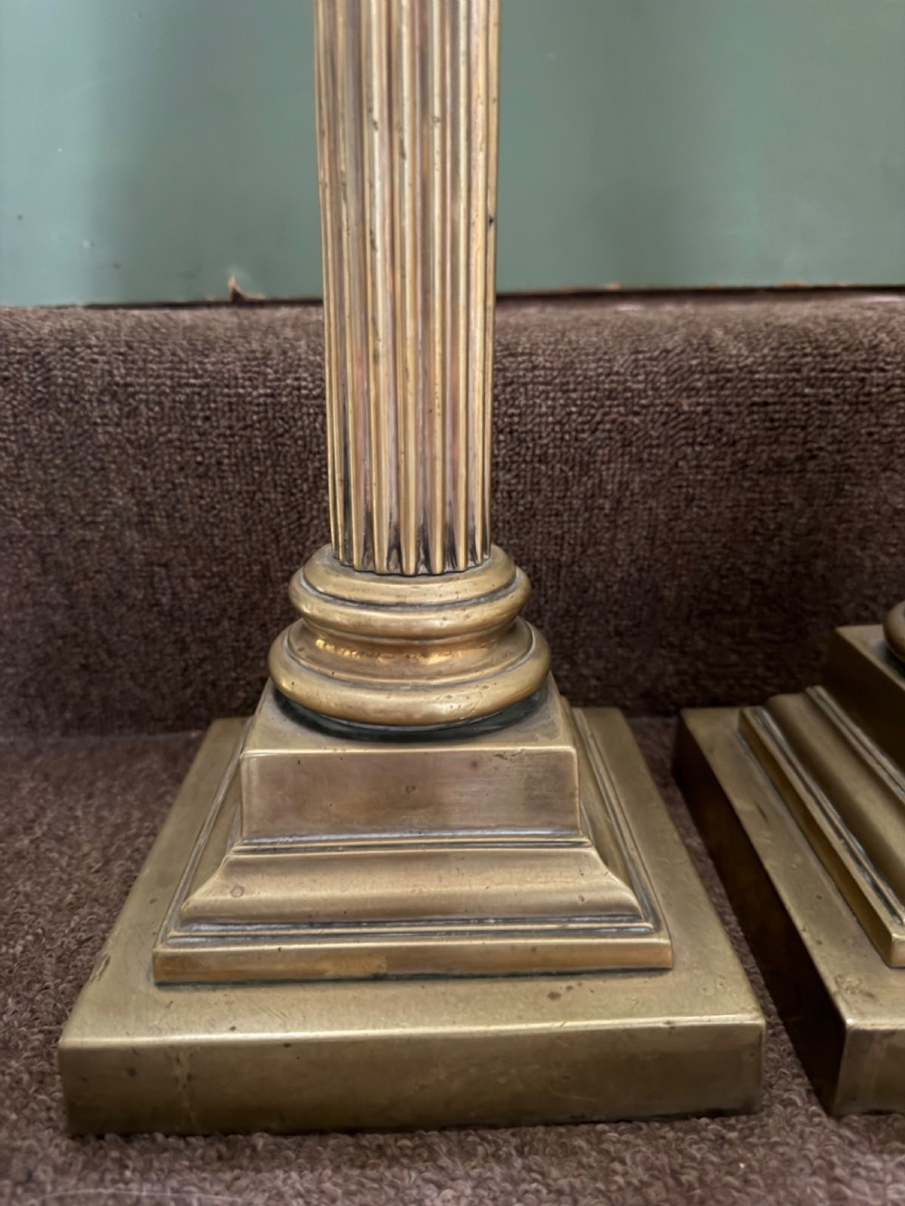 A pair of 19th-century brass table lamps featuring fluted classical Corinthian columns set on stepped square plinths. View VI