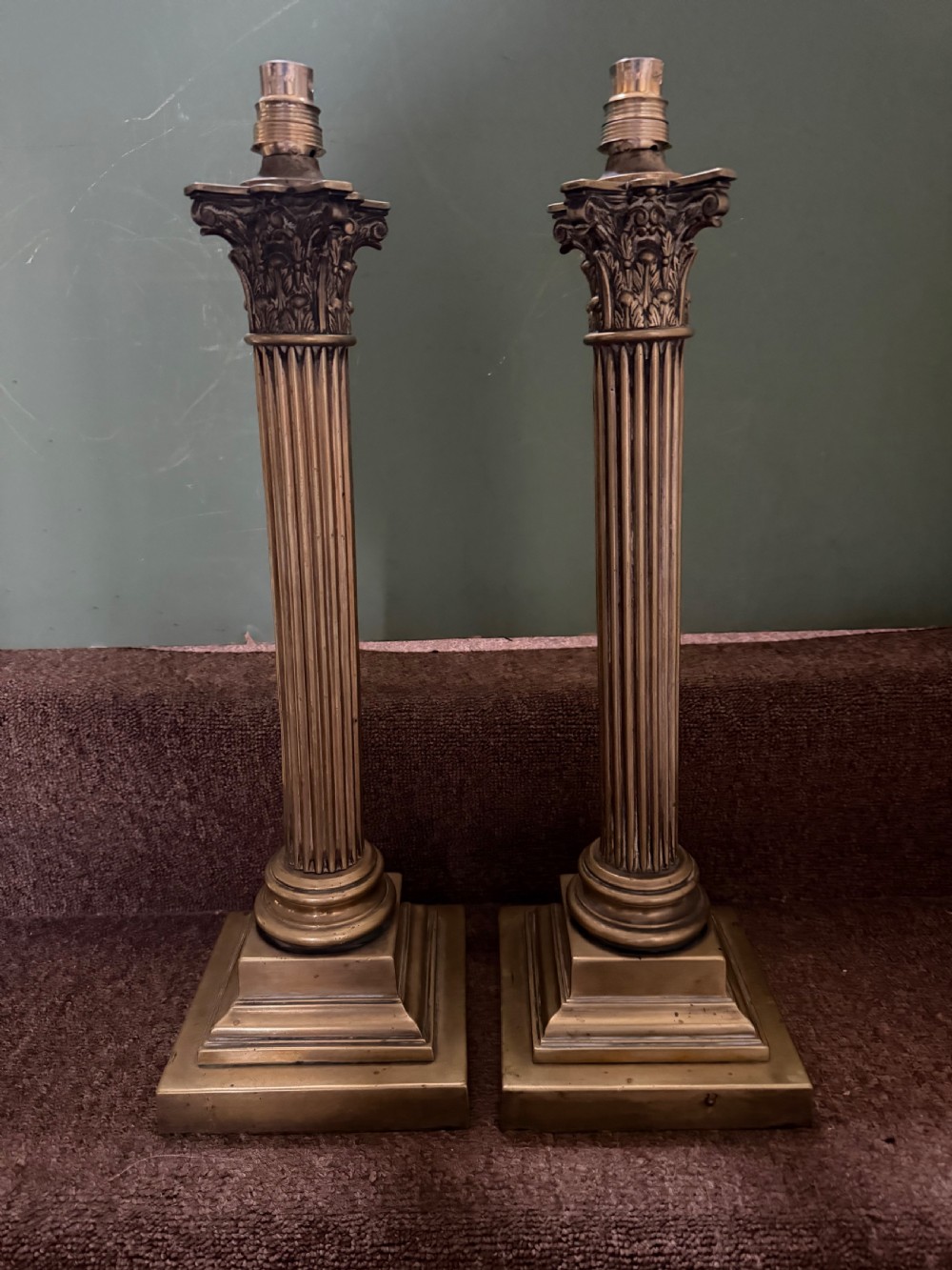 A pair of 19th-century brass table lamps featuring fluted classical Corinthian columns set on stepped square plinths. View VII