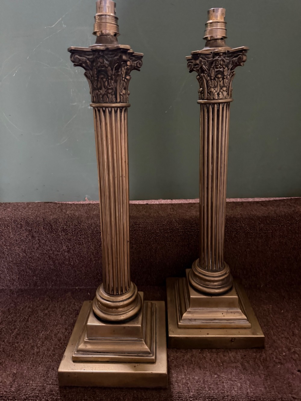 A pair of 19th-century brass table lamps featuring fluted classical Corinthian columns set on stepped square plinths. View XIII