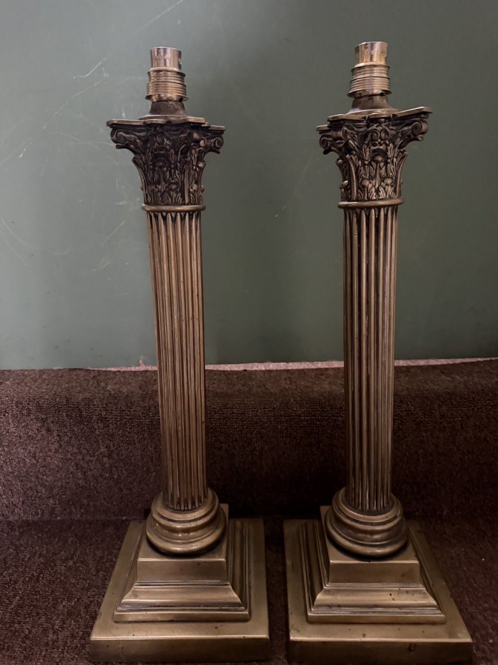 A pair of 19th-century brass table lamps featuring fluted classical Corinthian columns set on stepped square plinths. View XIV