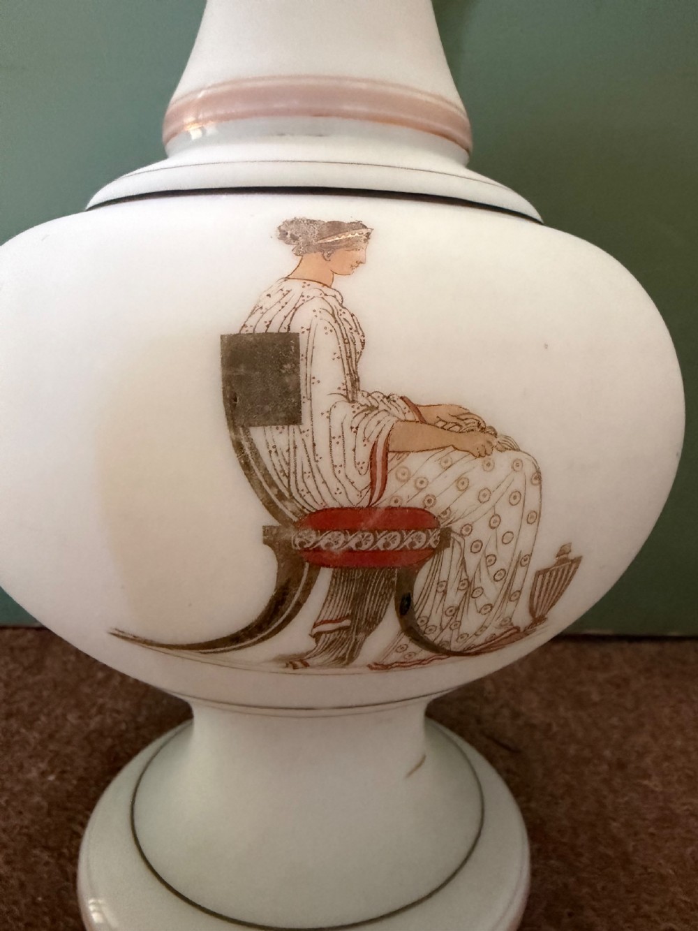 A pair of white opaline glass vases featuring flared necks decorated with orange Greek key patterns and baluster bodies painted with classical Grecian warrior figures. View XIV