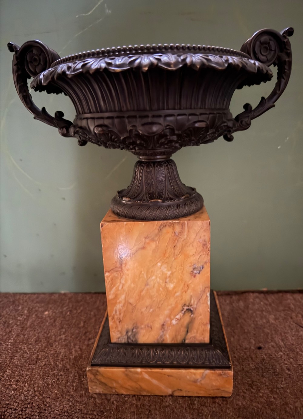 A pair of early 19th-century French Charles X dark bronze tazze with scrolling handles set upon yellow Siena marble plinth bases. View III