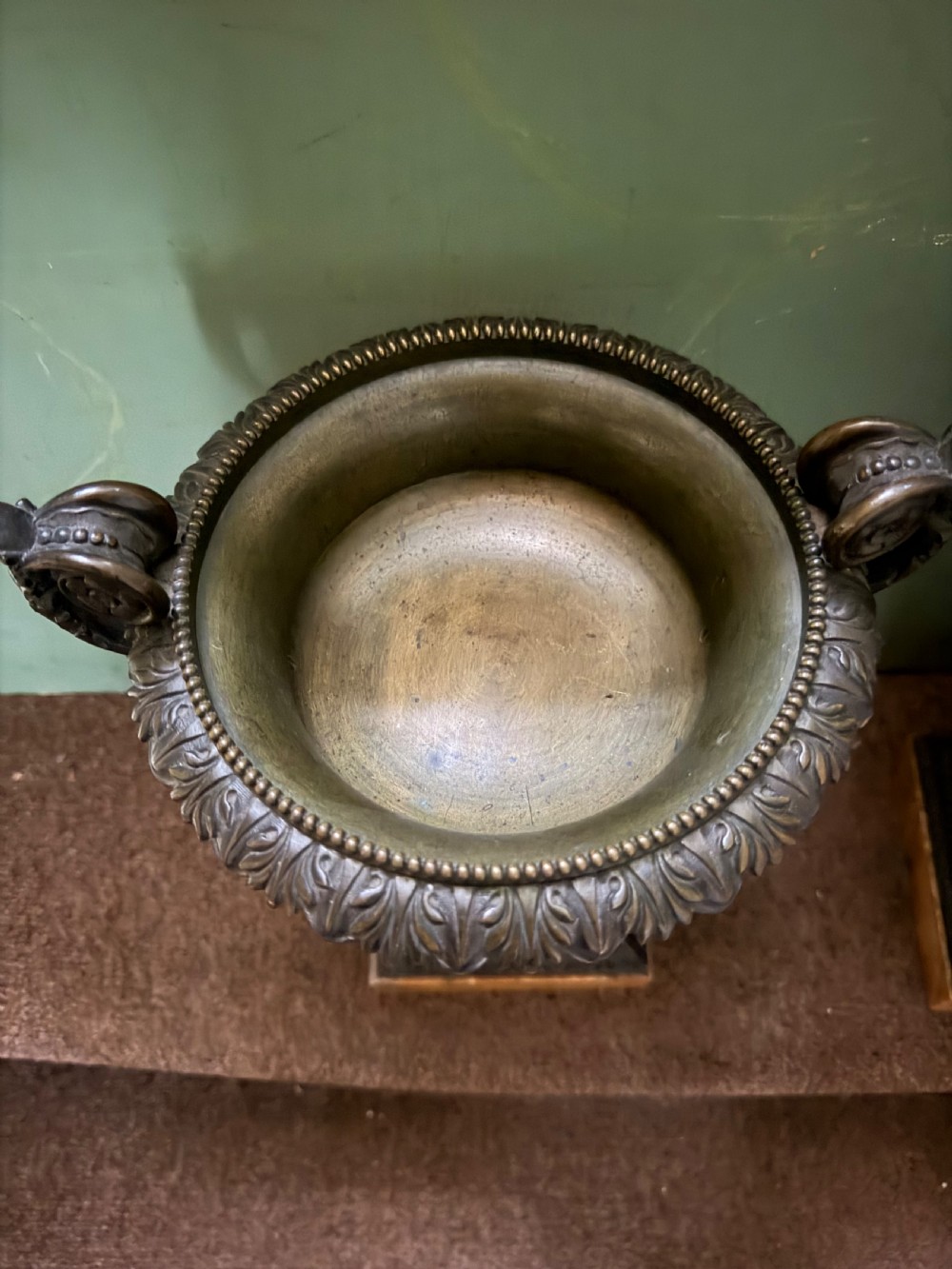 A pair of early 19th-century French Charles X dark bronze tazze with scrolling handles set upon yellow Siena marble plinth bases. View V