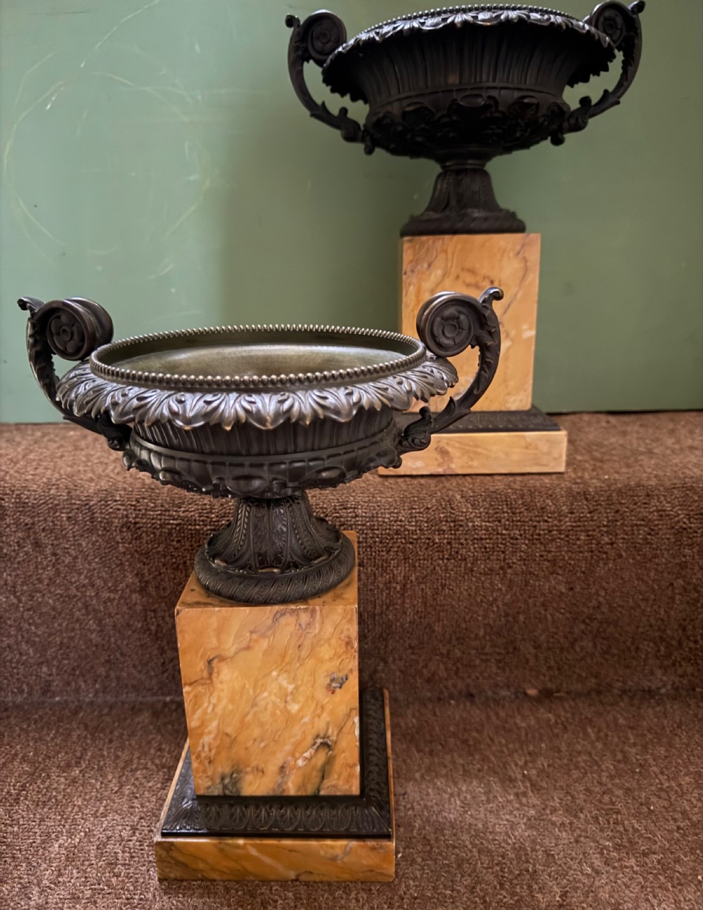 A pair of early 19th-century French Charles X dark bronze tazze with scrolling handles set upon yellow Siena marble plinth bases. View XI