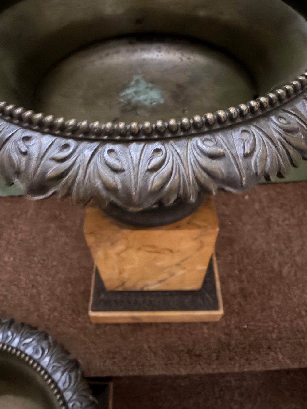 A pair of early 19th-century French Charles X dark bronze tazze with scrolling handles set upon yellow Siena marble plinth bases. View XII