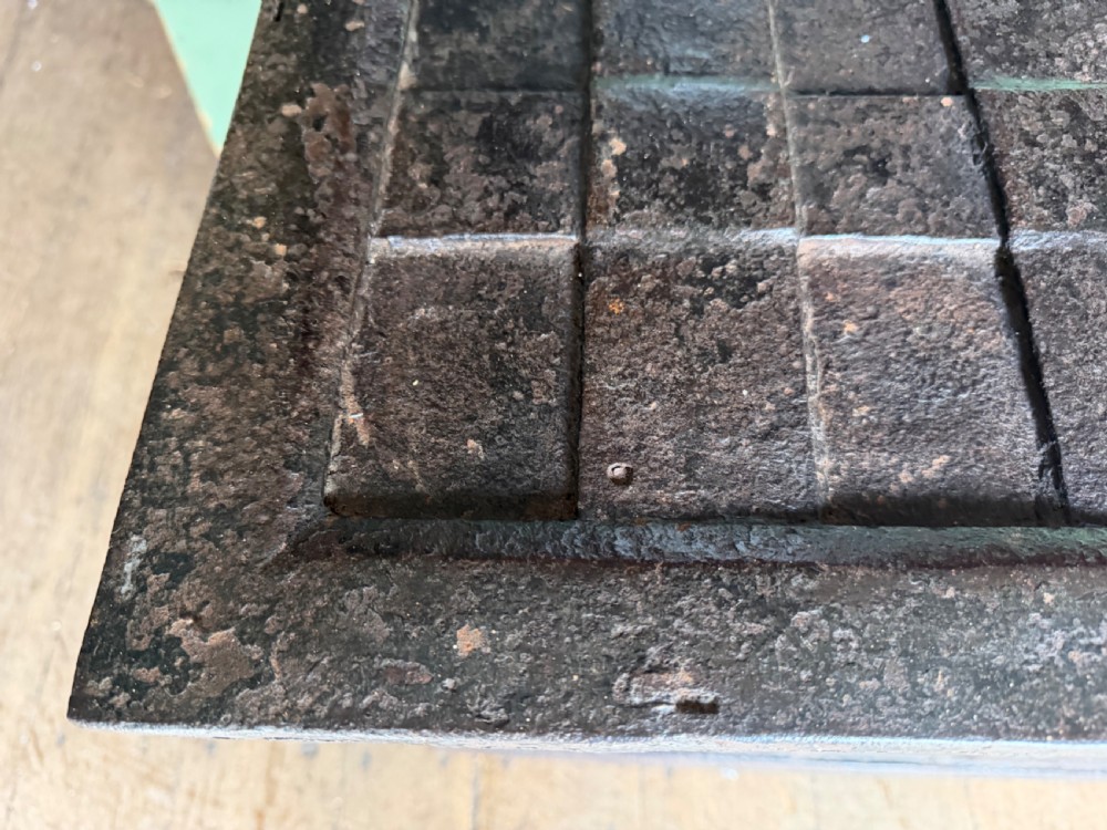 A rectangular late seventeenth-century wrought iron strongbox with criss-crossing riveted bands and a heavy central iron locking hasp. View IV