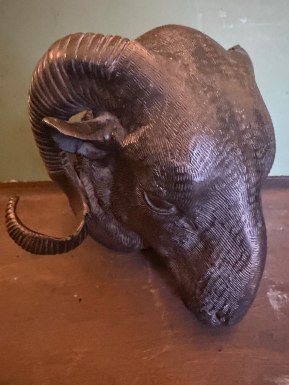 A late 19th-century cast bronze study featuring a ram head with detailed spiralled horns and textured fleece. View III