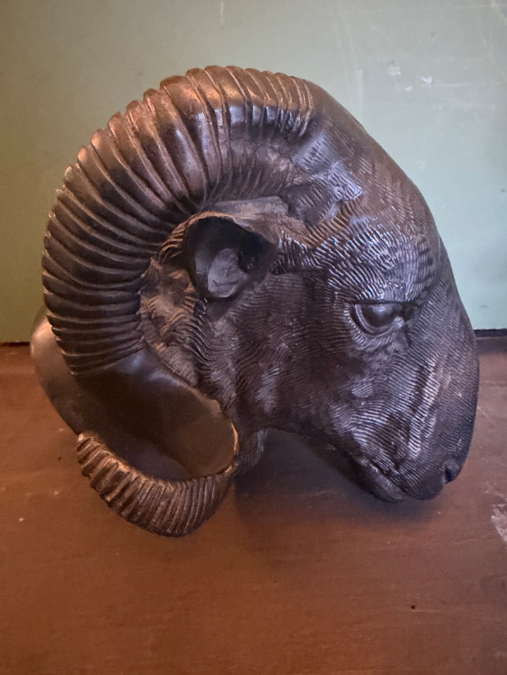 A late 19th-century cast bronze study featuring a ram head with detailed spiralled horns and textured fleece. View IV