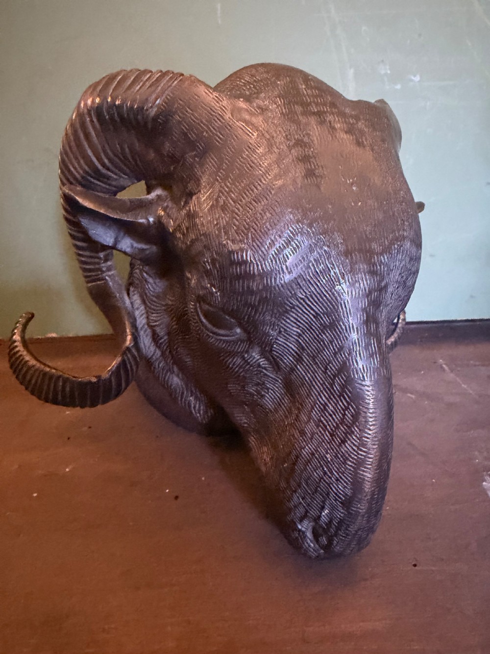 A late 19th-century cast bronze study featuring a ram head with detailed spiralled horns and textured fleece. View VI