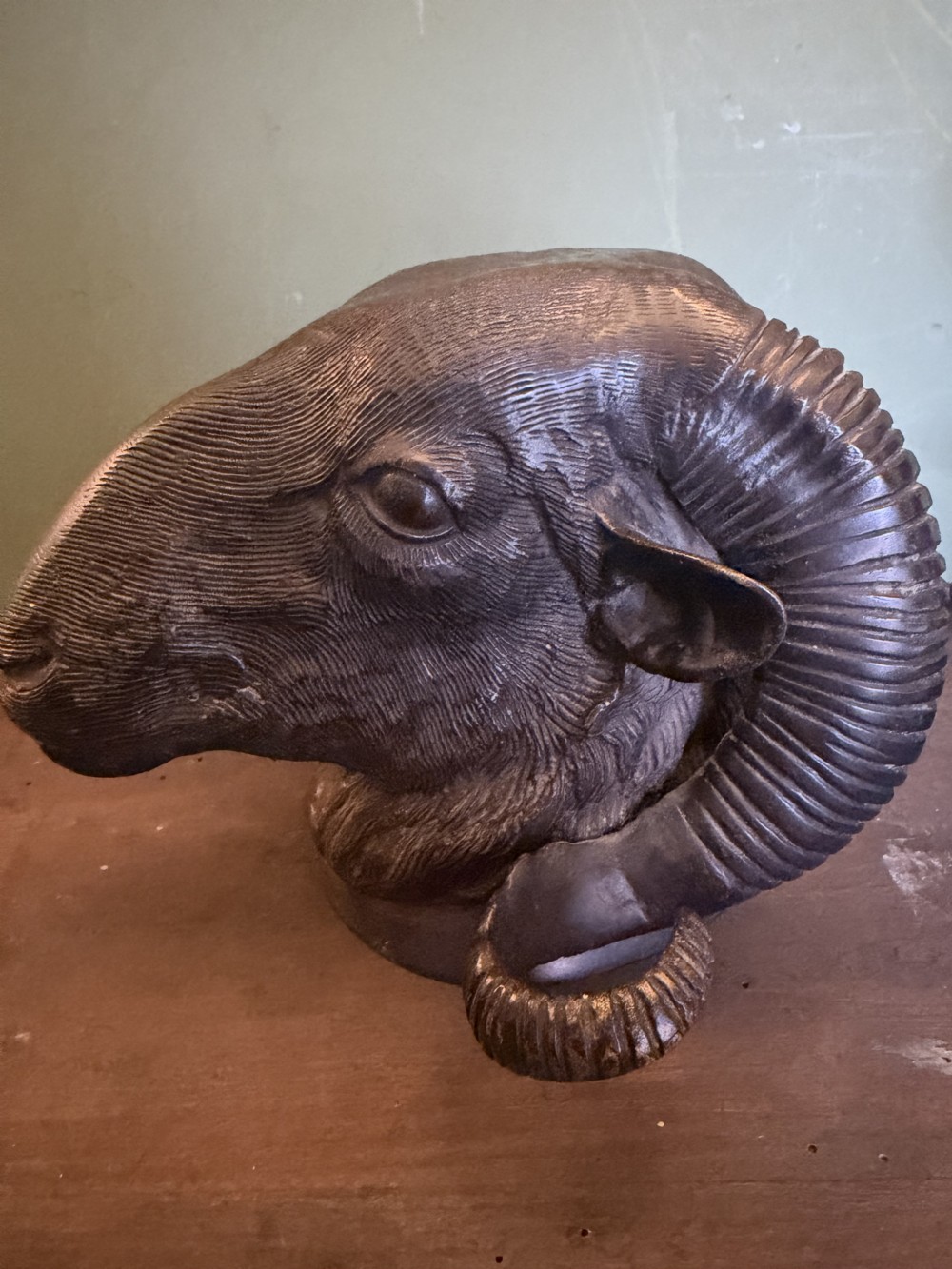 A late 19th-century cast bronze study featuring a ram head with detailed spiralled horns and textured fleece. View VIII