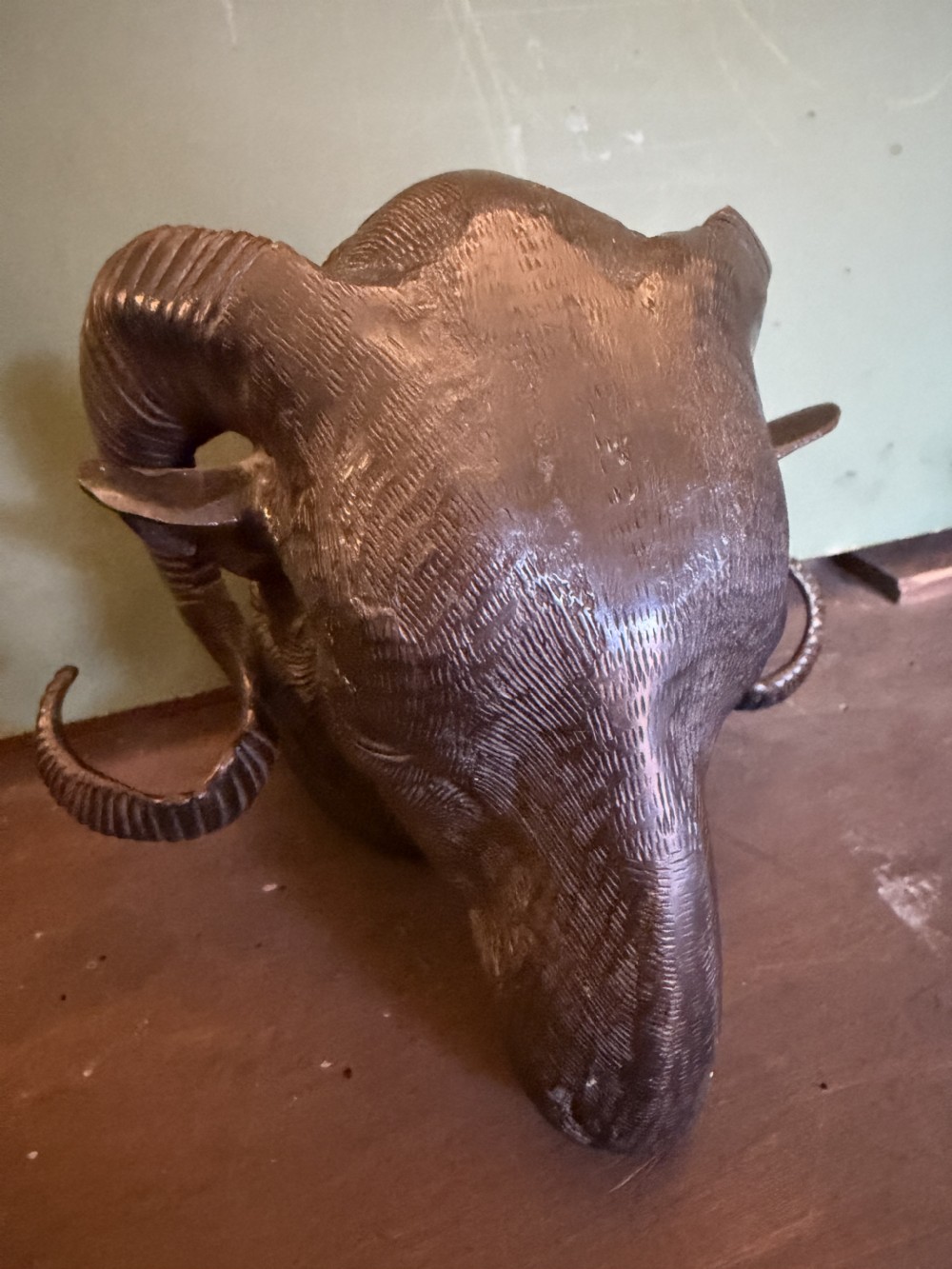 A late 19th-century cast bronze study featuring a ram head with detailed spiralled horns and textured fleece. View XII