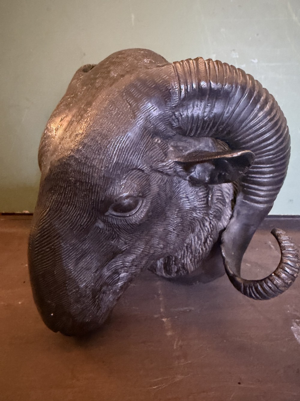 A late 19th-century cast bronze study featuring a ram head with detailed spiralled horns and textured fleece. View XIII