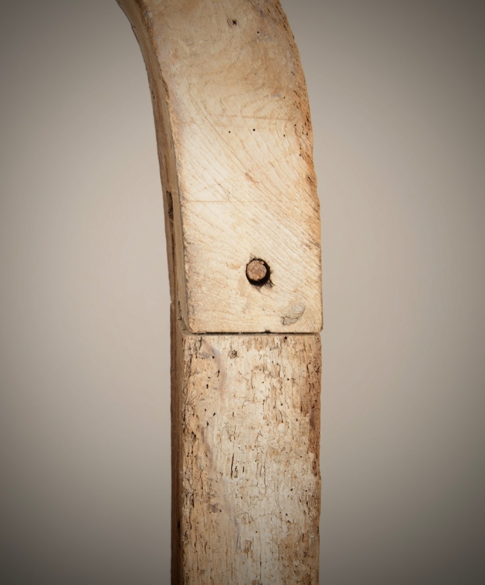 A hand-hewn oak Gothic window frame featuring a pointed arch apex and traditional pegged mortise joinery. View IV