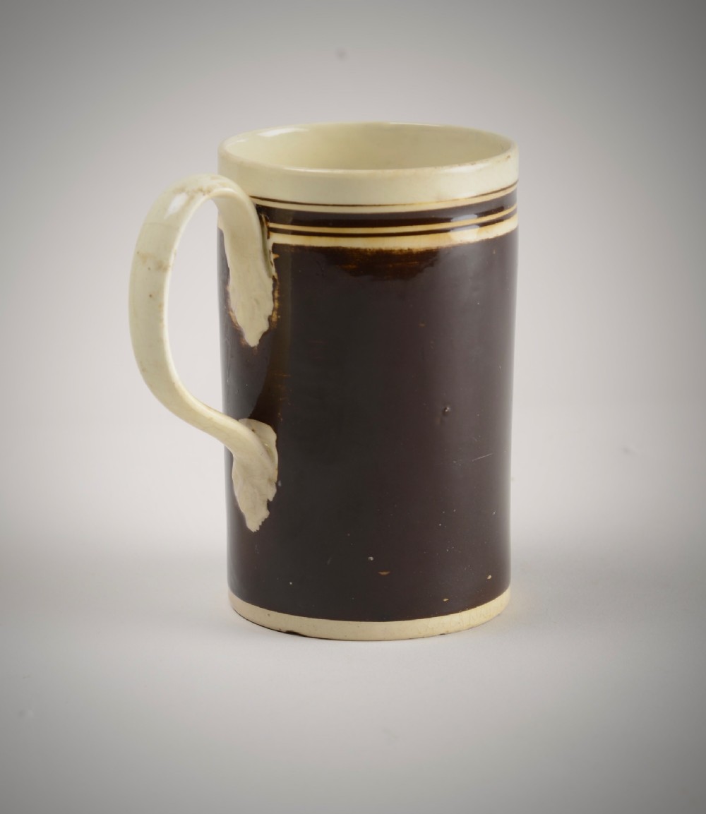 Creamware slip decorated mug.