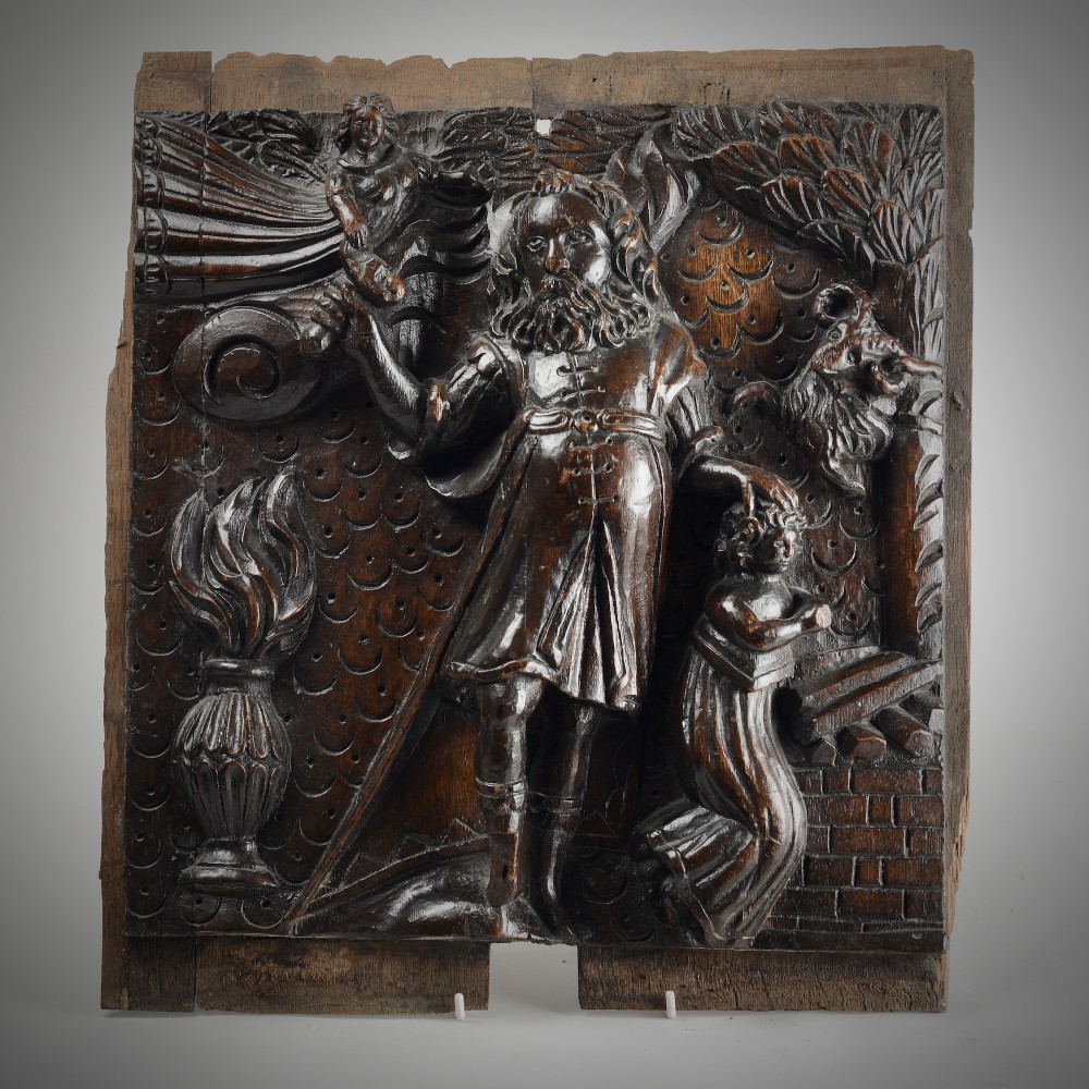 A square dark oak timber panel featuring a hand-carved relief depicting the biblical scene of Abraham and Isaac.