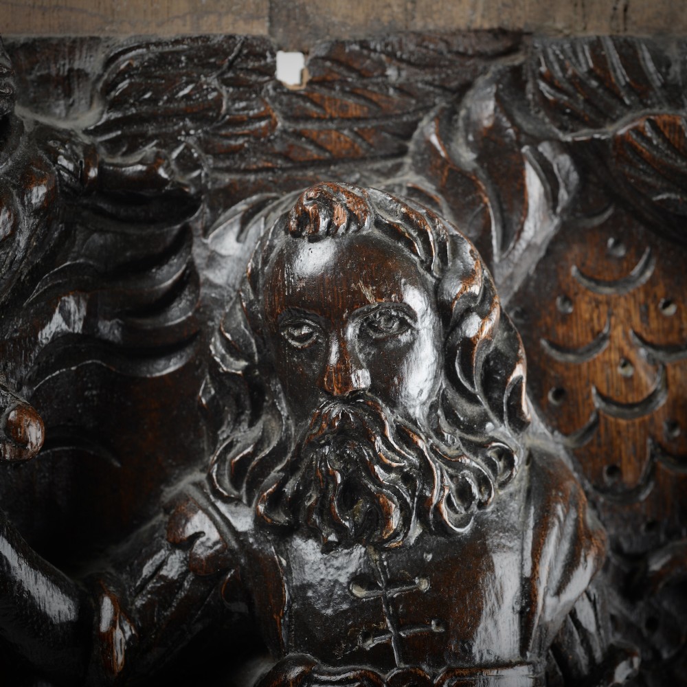 A square dark oak timber panel featuring a hand-carved relief depicting the biblical scene of Abraham and Isaac. View III