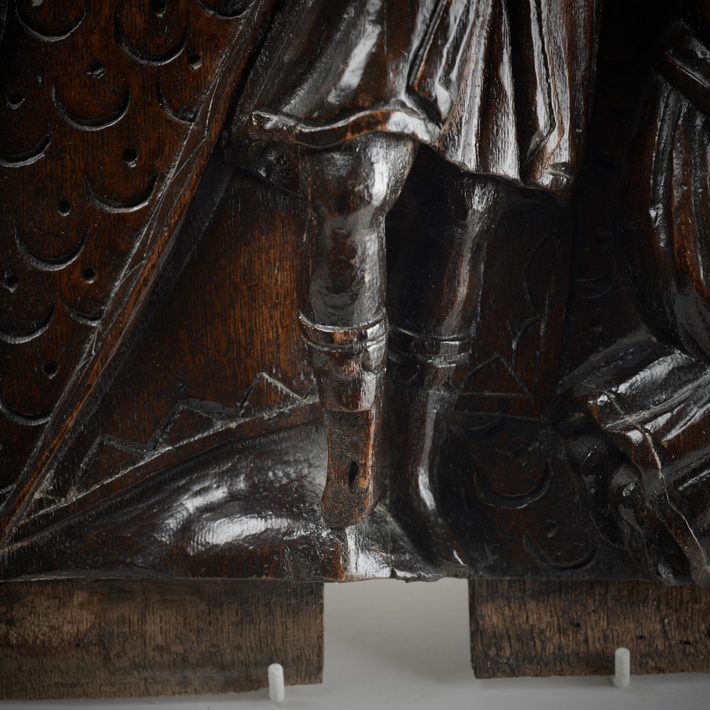 A square dark oak timber panel featuring a hand-carved relief depicting the biblical scene of Abraham and Isaac. View VII
