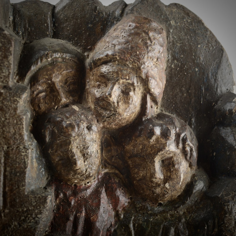 A late medieval carved wooden relief depicting the nativity with Mary, Joseph, and the Christ child under a thatched roof structure with traces of original polychrome paint. View VI