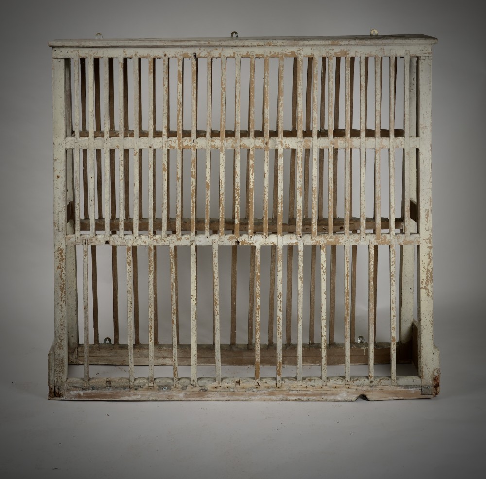 A two-tier painted wooden country house plate rack featuring a distressed off-white finish and vertical slotted spindles. View VII