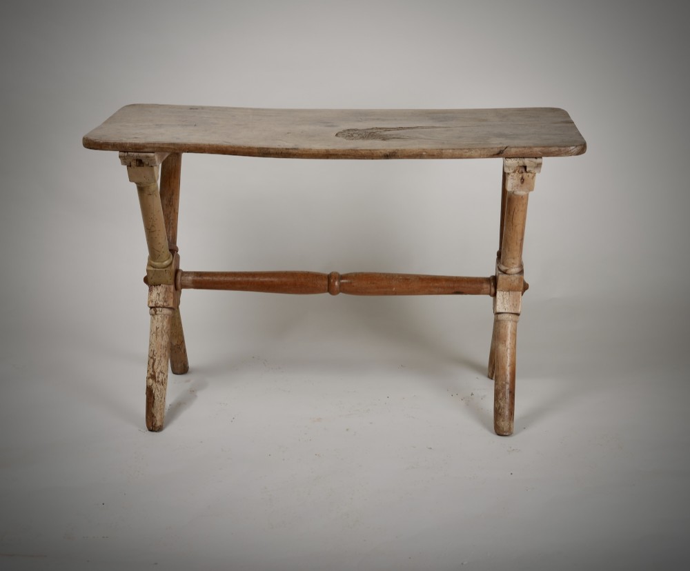 An antique rustic wooden tavern table featuring a rectangular plank top resting on an X-frame trestle base joined by a turned central stretcher. View II