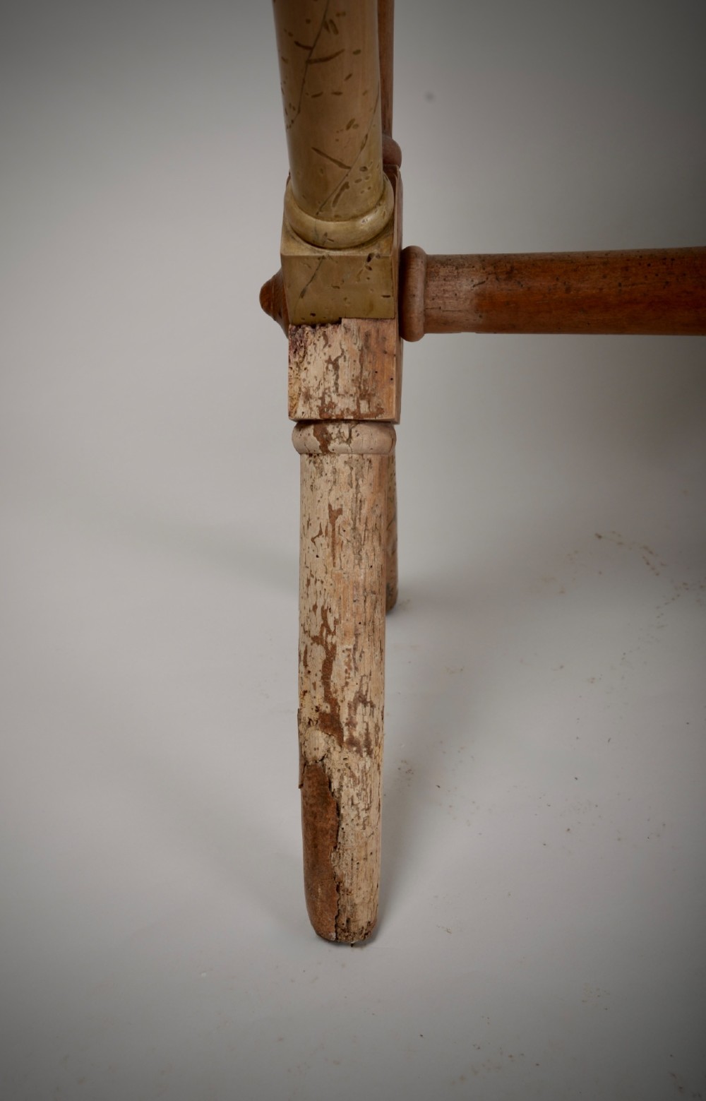An antique rustic wooden tavern table featuring a rectangular plank top resting on an X-frame trestle base joined by a turned central stretcher. View III
