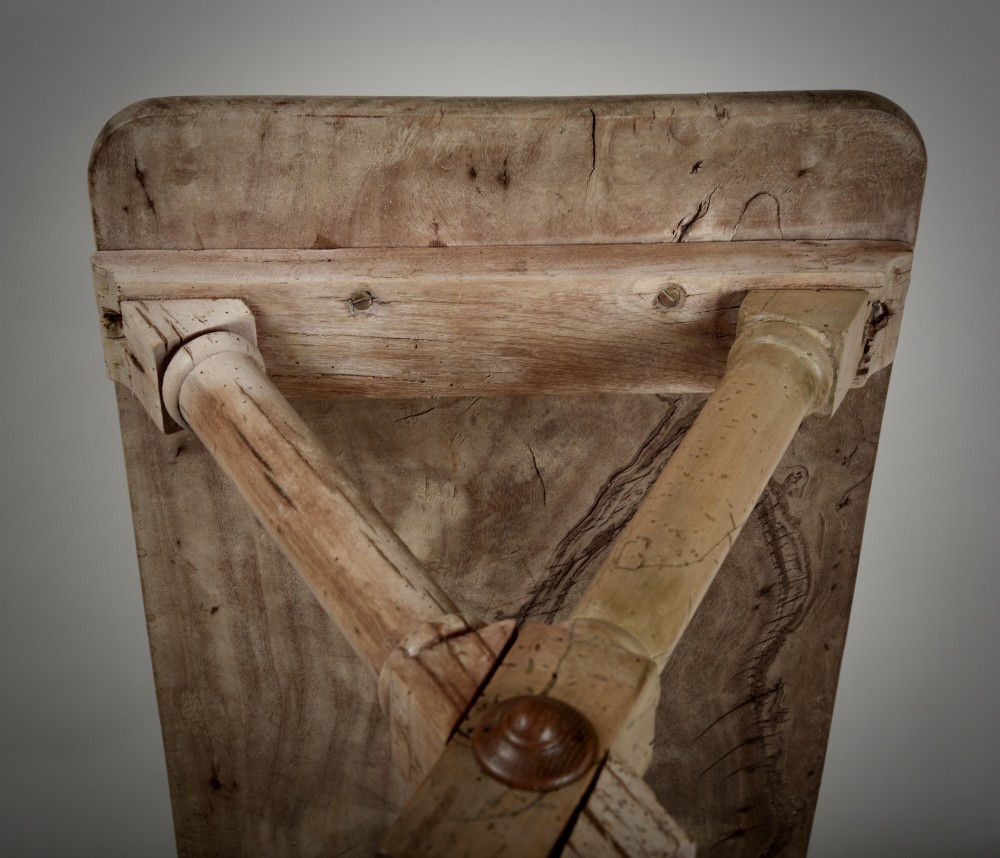 An antique rustic wooden tavern table featuring a rectangular plank top resting on an X-frame trestle base joined by a turned central stretcher. View VIII