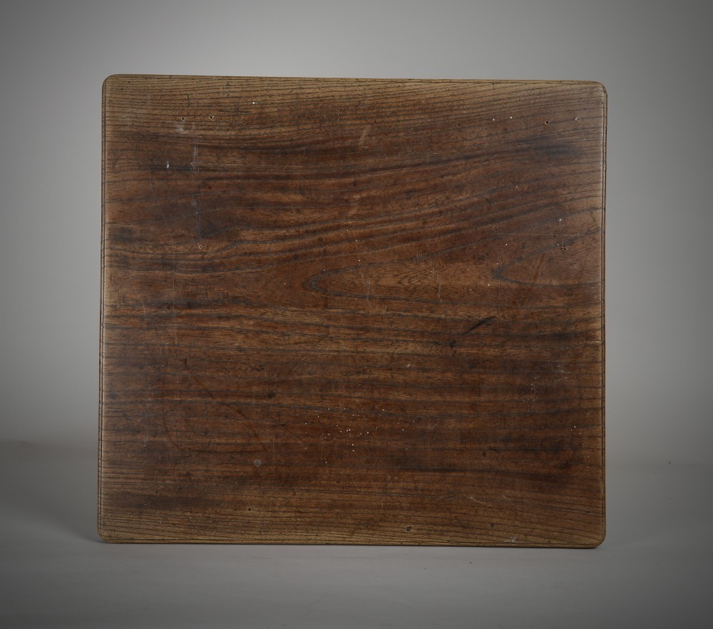A square dark oak treen serving board with rounded corners, showing natural grain and aged surface patina. View II