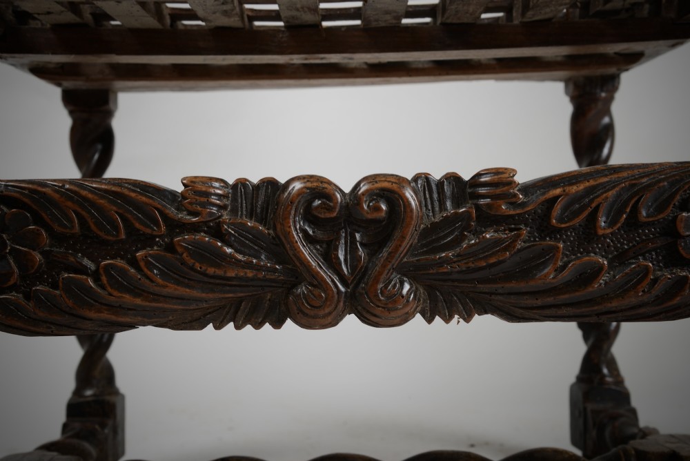 A dark walnut Charles II style open armchair featuring intricate barley twist uprights, a carved floral cresting rail, a slatted timber lattice back, and turned stretchers. View VI