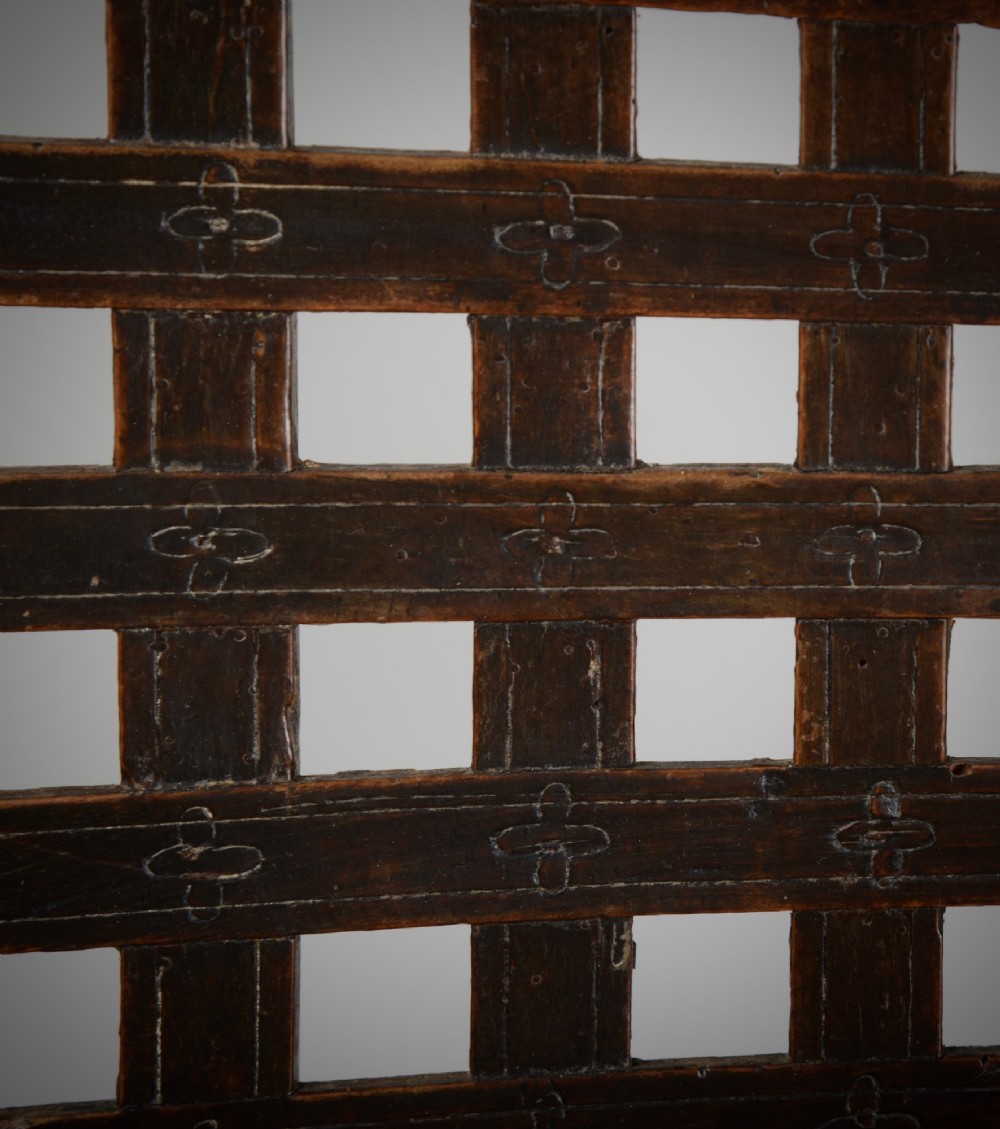 A dark walnut Charles II style open armchair featuring intricate barley twist uprights, a carved floral cresting rail, a slatted timber lattice back, and turned stretchers. View VIII