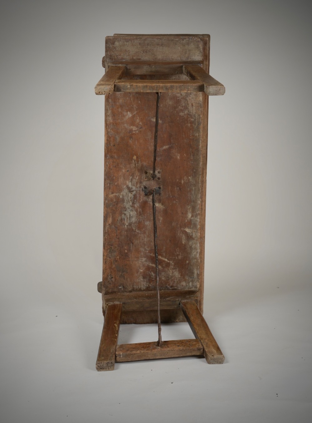A Renaissance style carved wooden bench featuring two profile portrait roundels flanking a central cross on the backrest and wrought iron support stretchers beneath. View X