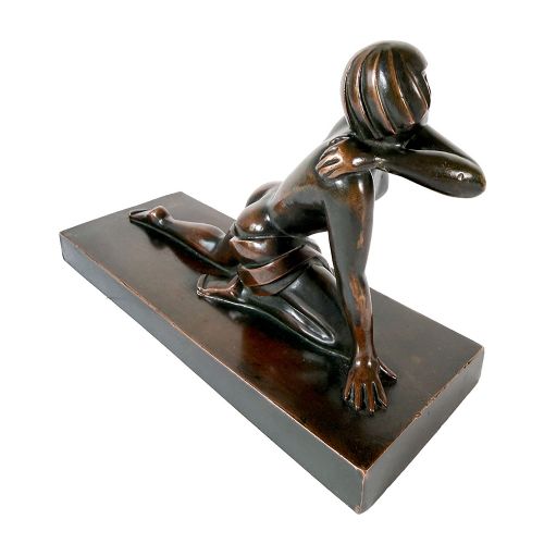 An Art Deco dark patinated bronze sculpture depicting a stylised female figure resting on an integrated rectangular bronze base. View V