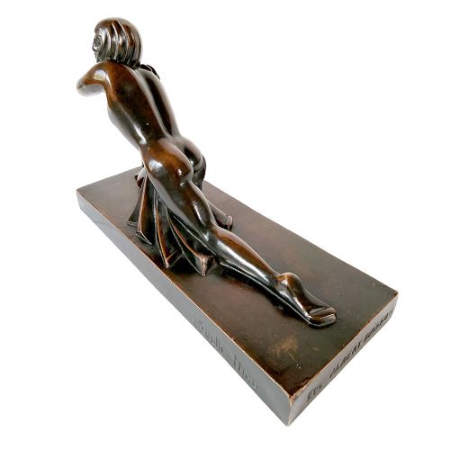 An Art Deco dark patinated bronze sculpture depicting a stylised female figure resting on an integrated rectangular bronze base. View VI