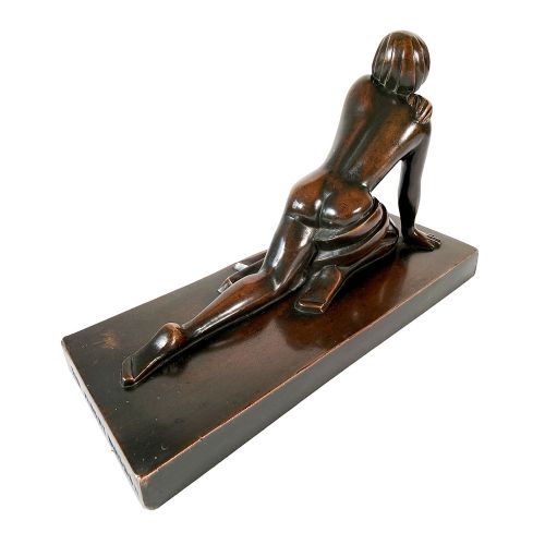 An Art Deco dark patinated bronze sculpture depicting a stylised female figure resting on an integrated rectangular bronze base. View VII