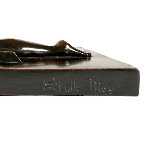 An Art Deco dark patinated bronze sculpture depicting a stylised female figure resting on an integrated rectangular bronze base. View VIII