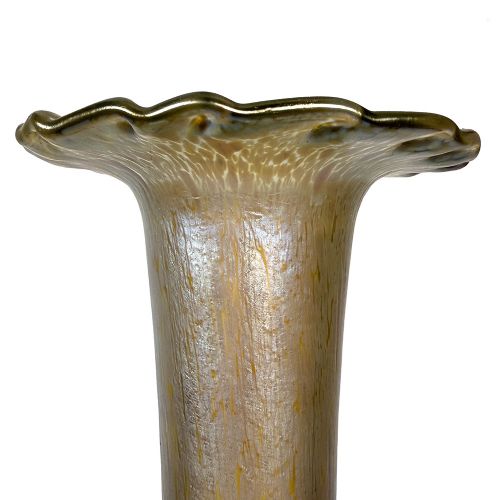 A tall Art Nouveau iridescent glass vase featuring a round bulbous base, an elongated slender stem, and a flared scalloped rim. View VI
