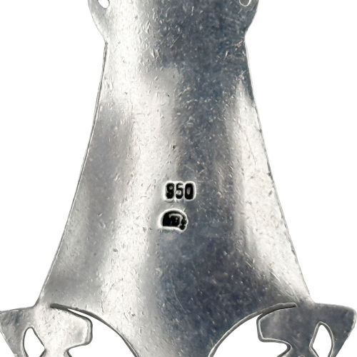 An Arts and Crafts sterling silver pendant featuring stylized Celtic knotwork and a central oval blue enamel cabochon suspended from a fine silver chain. View V