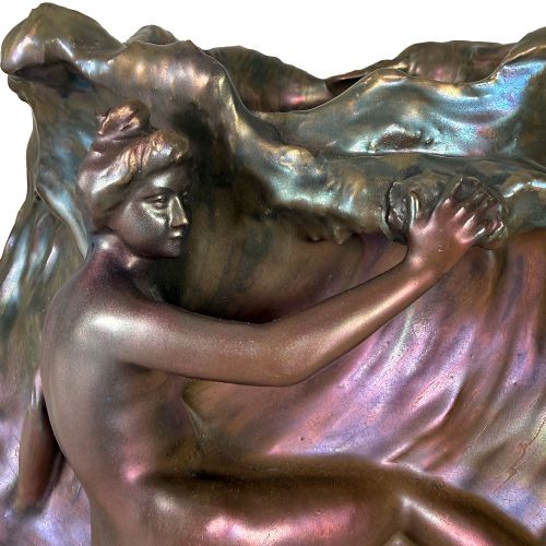 An Art Nouveau ceramic planter featuring an iridescent bronze and purple lustre glaze with a sculpted reclining female figure along undulating wave forms. View III