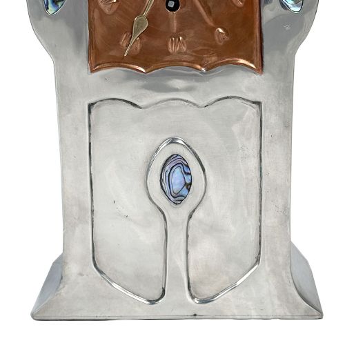 An Arts and Crafts pewter mantel clock featuring a square copper dial with Roman numerals and three iridescent abalone shell cabochon inlays. View IV