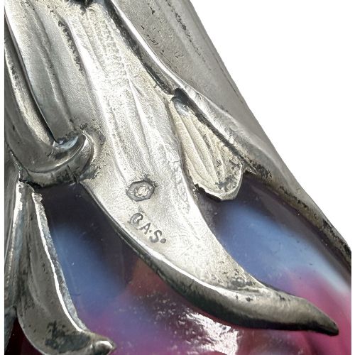 An Art Nouveau vase featuring wheel-carved purple and white glass with lily of the valley motifs set into a silver leaf-form pedestal base. View VII
