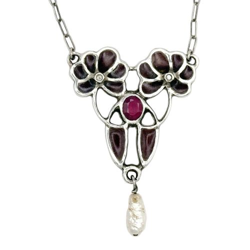 An Art Nouveau silver chain necklace featuring a stylized floral pendant inlaid with dark red enamel, a central ruby, and a pearl drop. View III