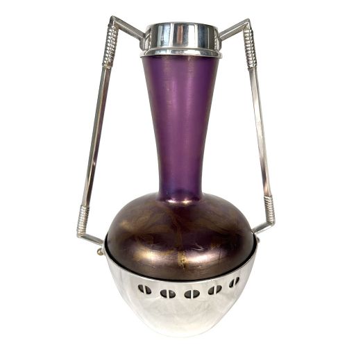An Art Nouveau Secessionist purple iridescent glass vase held within a geometric silver-plated metal mount with high angular handles. View II