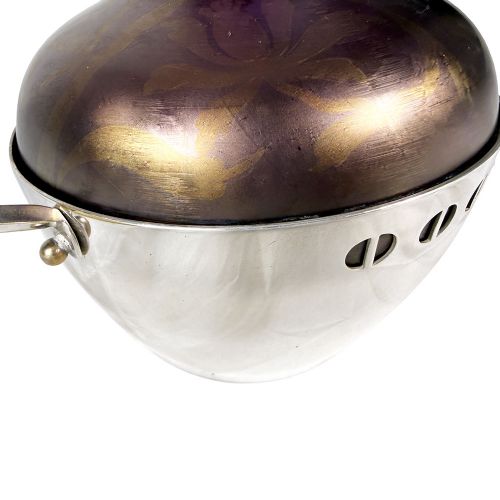 An Art Nouveau Secessionist purple iridescent glass vase held within a geometric silver-plated metal mount with high angular handles. View VII